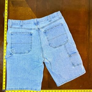 Light wash blue carpenter jorts yellow lining